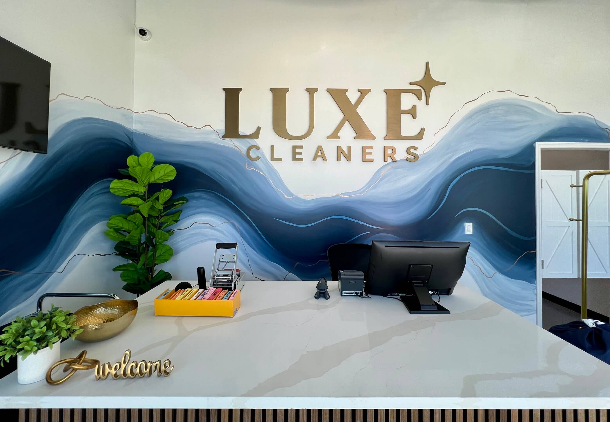 welcame desk luxe cleaners front